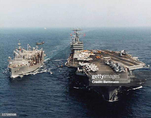 The Nuclear Aircraft carrier USS Abraham Lincoln performing an underway replenishment exercise with the USS Kalamazoo in the Virginia Capes.