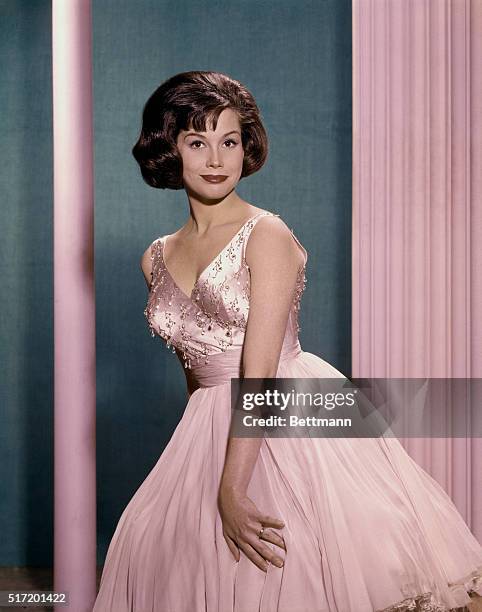Mary Tyler Moore Actress wearing a pink evening dress in a full length publicity still, color slide, circa 1965.