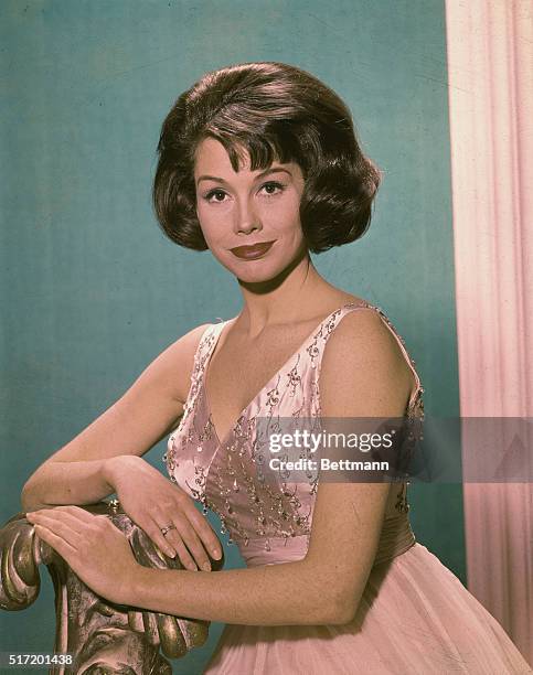 Mary Tyler Moore Actress wearing a pink evening dress in an undated publicity still. Color slide, circa 1965.