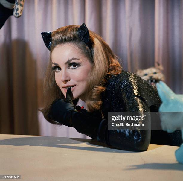 JULIE NEWMAR AS CATWOMAN BITES ON HER GLOVE FROM A PUBLICITY PHOTO OF THE TV SERIES "BATMAN", THAT RAN FROM 1966-1968. COLOR SLIDE.