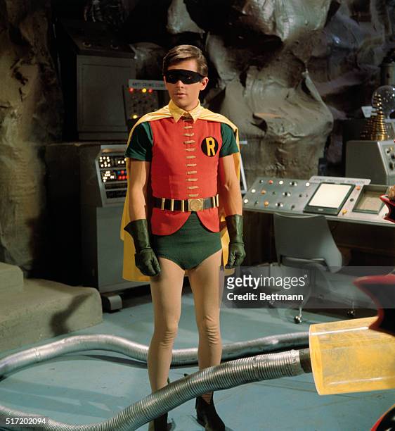 Television handout of Burt Ward as Robin, Batman's loyal sidekick and fellow crime fighter. Robin is shown in the Batcave on the set of Batman with a...