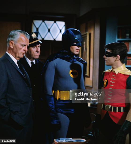 Scene from ABC's television series Batman. In this scene , Police Commissioner Gordon , Chief O'Hara , Batman , and Robin use their collective...