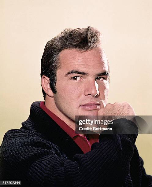 Burt Reynolds posing in a publicity shot for his character in the television series Gunsmoke.