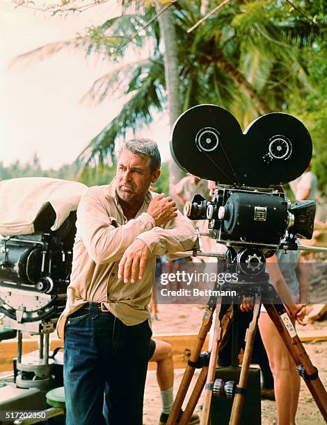 Universal Studio...Cary Grant relaxes on the set of Universal's romantic adventure comedy, Father Goose, a Granox production, in Technicolor,...