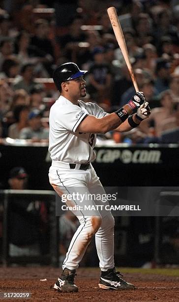 New York Mets catcher Mike Piazza watches the flight of his game-winning two-run home run in the bottom of the eighth inning against the Atlanta...