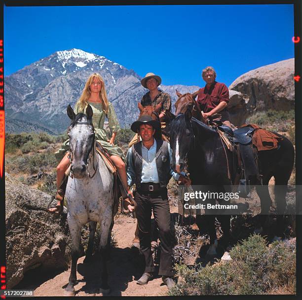 Publicity photo of the cast members of the TV Western Cimarron Strip. Stuart Whitman, Percy Herbert, Randy Boone and Jill Townsend on horseback.