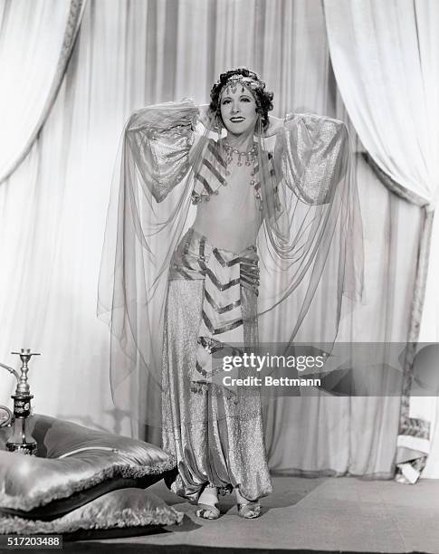 Elusive Oriental charm is part of the makeup of Gracie Allen, who appears in Paramount's current Win or Lose.