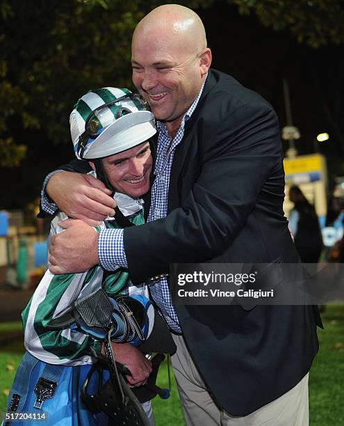 Trainer Peter Moody is embraced by Jockey Luke Nolen after riding Dig A Pony in Race 7, the William Hill Sunline Stakes during Melbourne Racing at...