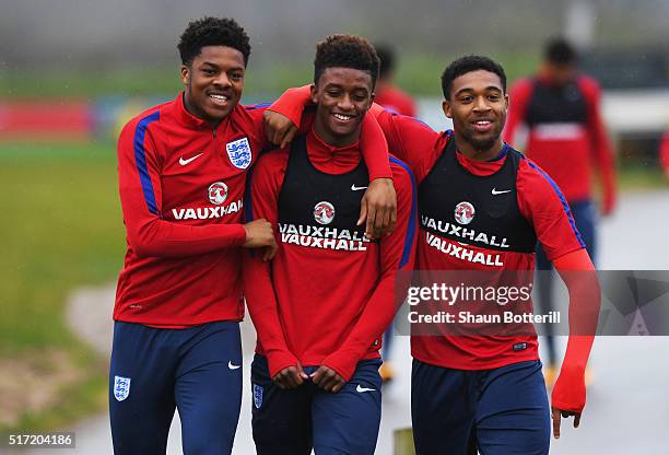 Chuba Akpom, Demarai Gray and Jordon Ibe joke during an England U21 training session ahead of their UEFA U21 European Championship qualifier against...