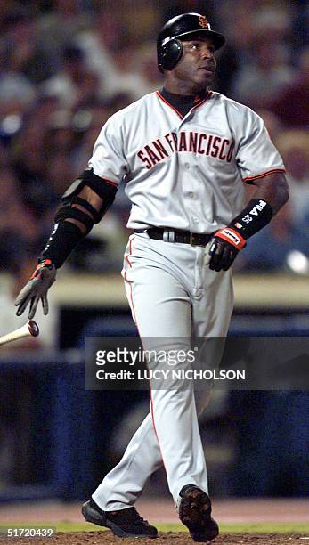 San Francisco Giants' Barry Bonds watches the ball after hitting his 67th home run of the season against the Los Angeles Dodgers, in Los Angeles, 24...