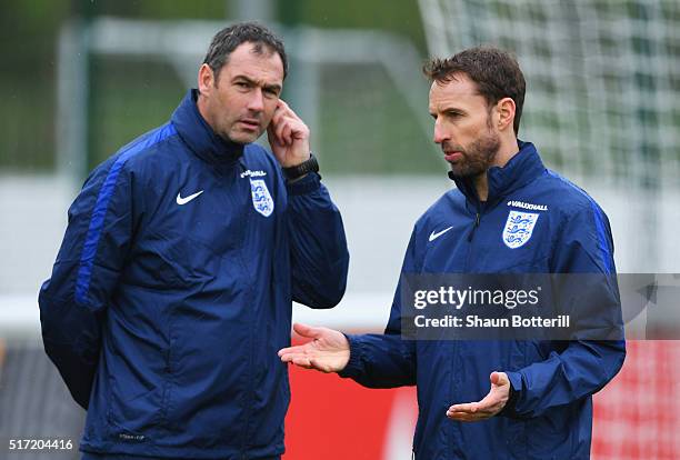 Gareth Southgate manager of England U21 and coach Paul Clement in discussion during an England U21 training session ahead of their UEFA U21 European...