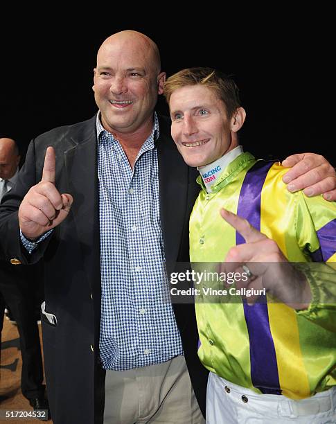 Brad Rawiller poses with trainer Peter Moody after riding Flamberge to win Race 6, the Mitchelton Wines William Reid Stakes during Melbourne Racing...