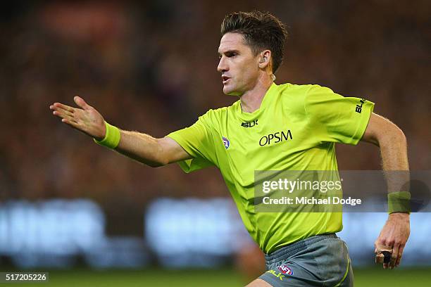 Field umpire gives a free kick for deliberate out of bounds during the round one AFL match between the Richmond Tigers and the Carlton Blues at...