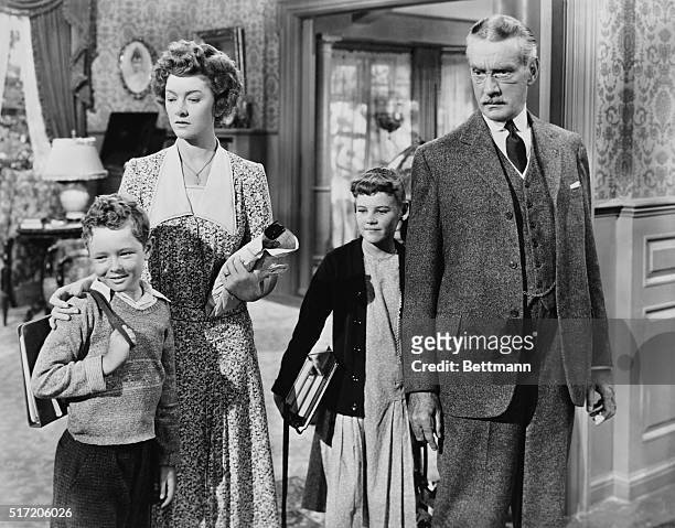 American actors Myrna Loy and Clifton Webb with Jimmy Hunt and Carol Nugent as two of their children in 'Cheaper by the Dozen', directed by Walter...