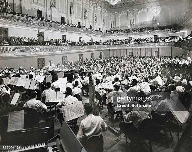 Arthur Fiedler, conducting the Boston Pops Orchestra, at Symphony Hall, Boston, Mass.