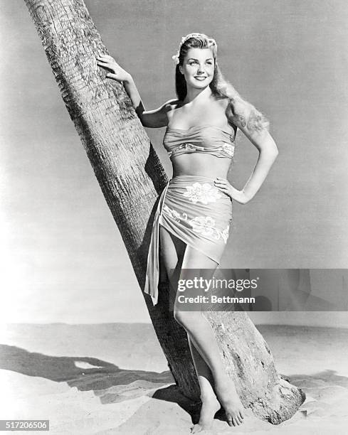 Esther Williams, movie star, in sarong. Full-length photograph.