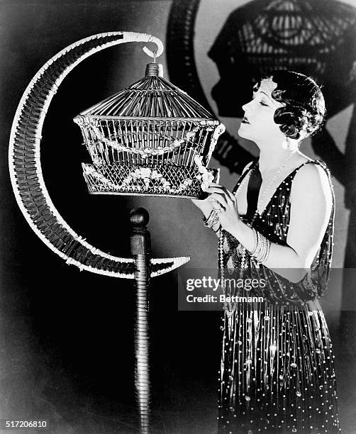 Gloria Swanson, silent movie star, in scene from Her Gilded Cage.