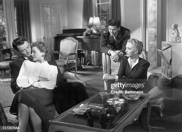 Actor Gregory Peck holds an unidentified actress as John Garfield and Celeste Holm look on in the 1947 20th Century Fox' Production of "Gentleman's...