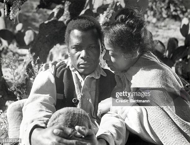 Actor Sidney Poitier and actress Ruby Dee act in a scene from the 1972 Columbia Pictures production of "Buck and the Preacher." Undated movie still.