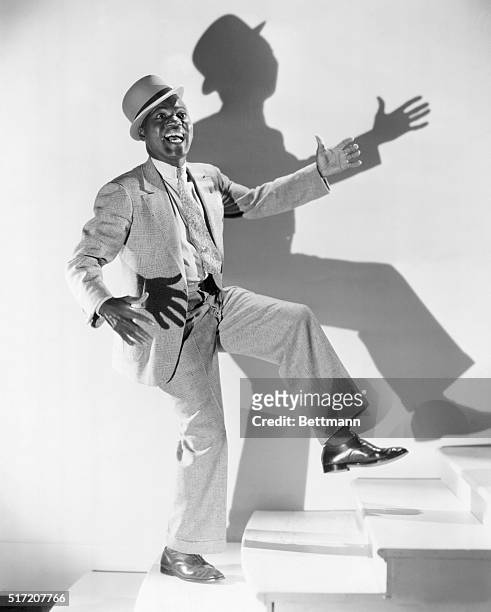 Bill Robinson is a most articulate man. He expresses his hapiness with every gesture, but particularly with his famous, tap dancing feet. He is shown...
