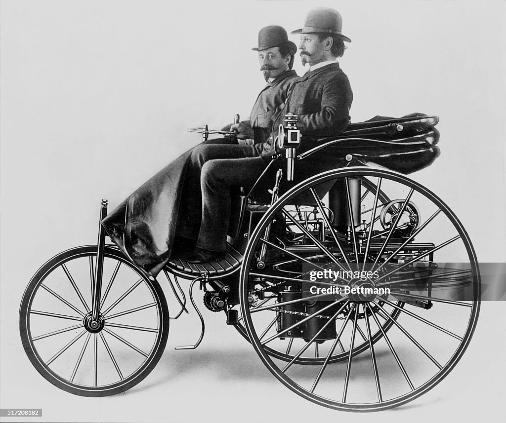 Inventor Karl Benz with his assistant Josef Brecht seated on the 1885 ...