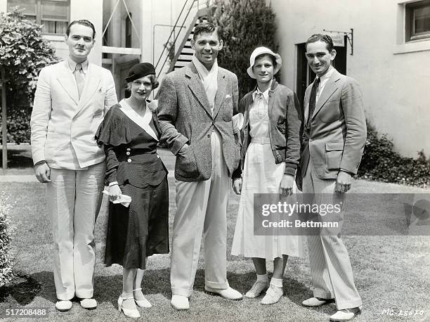 Mildred Didrickson, the one woman track team, who won the javelin contest in the Olympic Games for women is shown with others here. She won by...