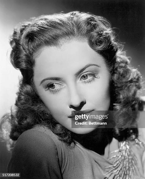 Barbara Stanwyck lets her hair and a few conventional bars down, in Samuel Goldwyn's, "Ball of Fire," in which she plays the role of "Sugar Puss"...