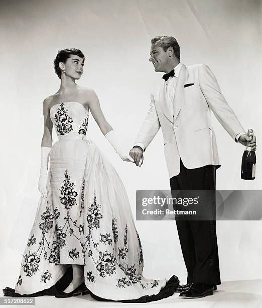 Piublicity handout from the 1954 film, "Sabrina." In this studio recreation of one of the movie's scenes, Audrey Hepburn and William Holden get into...