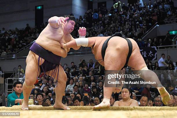 Akiseyama throws Toyohibiki to win during day twelve of the Grand Sumo Spring Tournament at the Edion Arena Osaka on March 24, 2016 in Osaka, Japan.