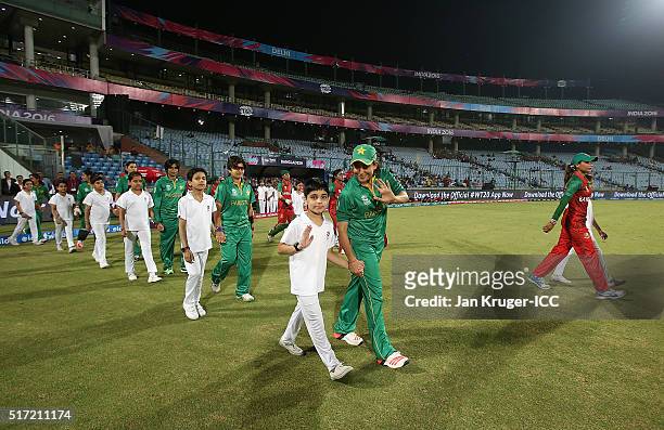Sana Mir, Captain of Pakistan and Jahanara Alam, Captain of Bangladesh lead their teams out during the Women's ICC World Twenty20 India 2016 match...