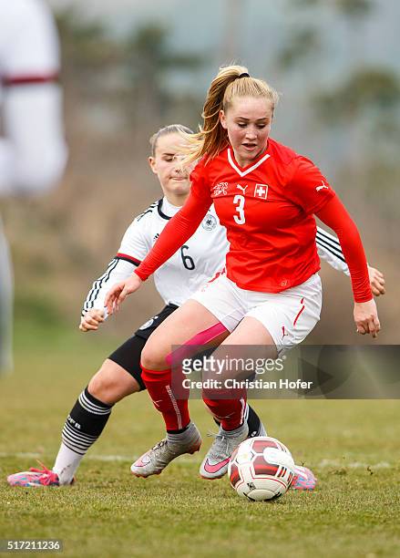 Lisa Schoeppl of Germany competes for the ball with Alicia Haller of Switzerland during the U17 Girl's Euro Qualifier match between Germany and...