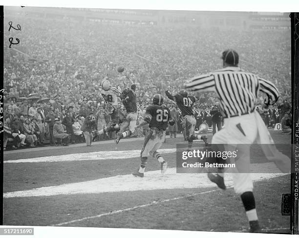 Pass thrown by Ohio State's Dave Leggett, intended for William Collmar , is incomplete as USC's Linden Crow breaks up the play in the first quarter...