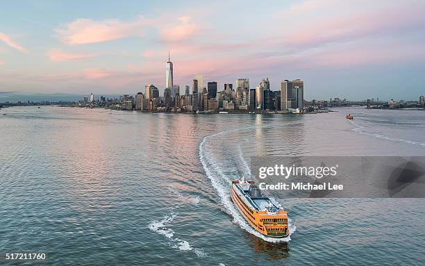 aerial lower manhattan sunset cityscape - new york - staten island ferry stock pictures, royalty-free photos & images