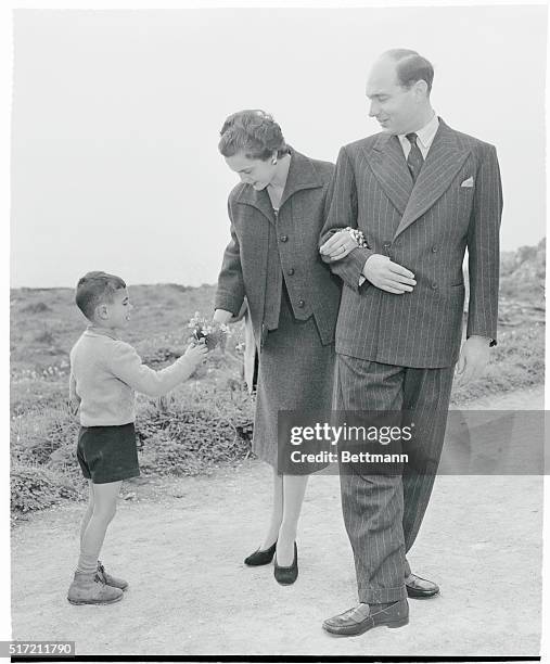 Royal Wedding. The royal lovers, Princess Maria Pia and Prince Alexander are presented with a bouquet of meadow flowers by a Portuguese boy as they...