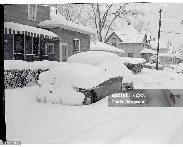 It will take more than windshield wiper to clear the snow off this car, one of many in South Bend that was hidden by a 14 inch snowfall. Traffic was...