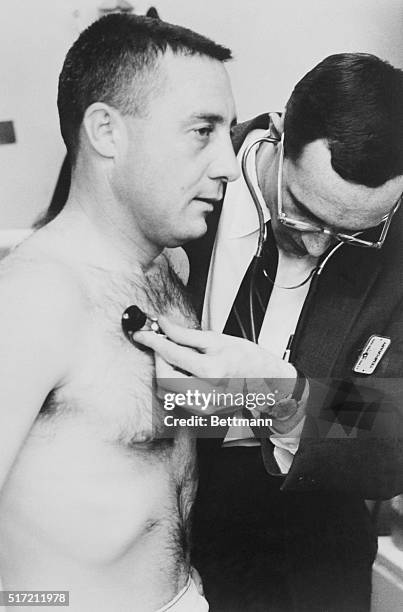 Physical examinations are routine for the National Aeronautics and Space Administration astronauts. Here Virgil I. Grissom is examined during...