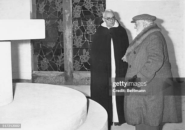Matisse, one of the foremost French painters, chatting with a priest inside his chapel at Saint-Pol-De-Vence . The chapel will be dedicated shortly.