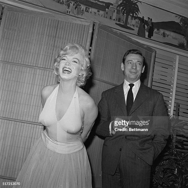 Actress Marilyn Monroe bubbles with glamor during a cocktail party here Jan. 15th for her new picture "Let's Make Love". Released in 1960.