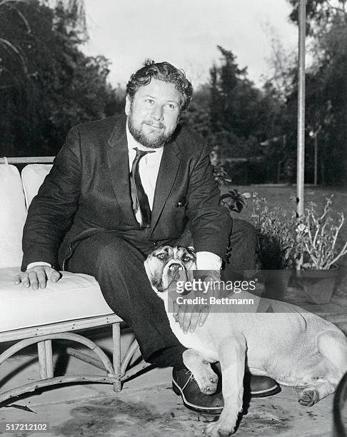 Peter Ustinov is shown at his home in Beverly Hills with one of his two Neapolitan Mastiffs which he brought to this country during the filming of...