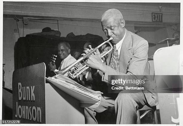 Bunk Johnson, with his New Orleans Band, makes a comeback in New York City.