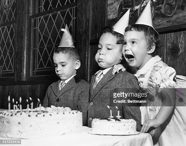 The three Collins siblings, all born on the same day in different years, express different reactions to their cakes. Paul seems indifferent;...