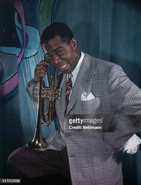 Famed jazz trumpeter Louis "Satchmo" Armstrong in photo placed in files in 49. Color photo.