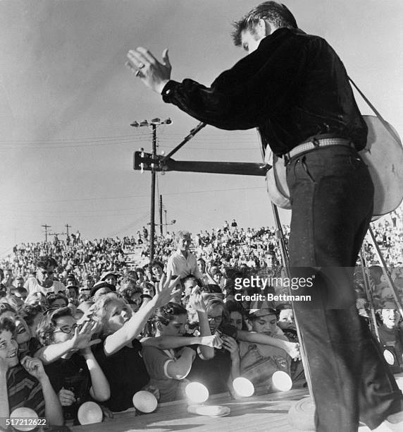 Tupelo, MS: Elvis Presley performs in Tupelo, Mississippi before his hometonw crowd.