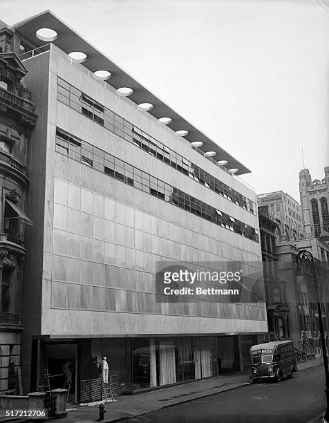 New York, NY: A view of the outside of the new $2 000 building of the Museum of Modern Art on West 53rd Street, showing the glass wall of the...