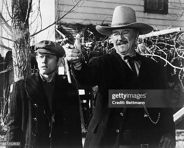 Ron Howard and John Wayne in a scene from the 1976 movie The Shootist.