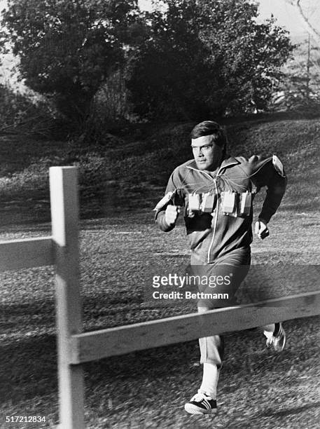 Photograph of Lee Majors in a scene from his television show "The Six Million Dollar Man." Filed in 1976.
