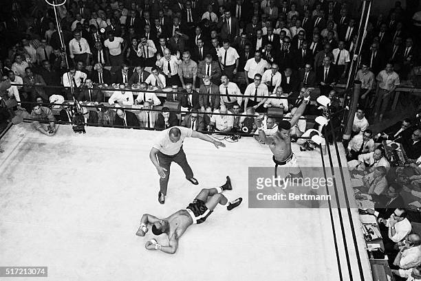 Lewiston, ME: A dramatic overheard photo reveals Sonny Liston spread-eagled on the canvas as heavyweight champion Cassius Clay raises his arms in...