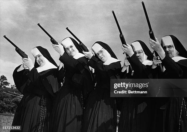 Kingston, MA: Sisters of Divine Providence set their sights as they try out new .22 caliber guns presented to them at camp Mishannock by Harrington...