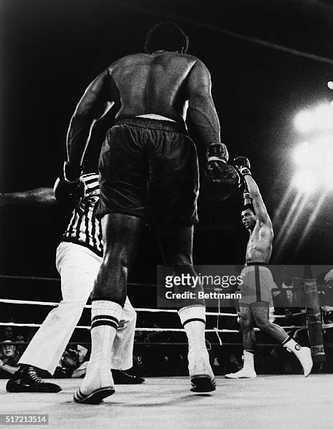 Kinshasa, Zaire: A triumphant Muhammad Ali raises his glove after regaining the World Heavyweight championship. UPI