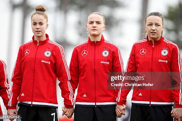 Giulia Gwinn, Lisa Schoeppl and Tanja Pawollek of Germany line up during the national anthem prior to the U17 Girl's Euro Qualifier match between...